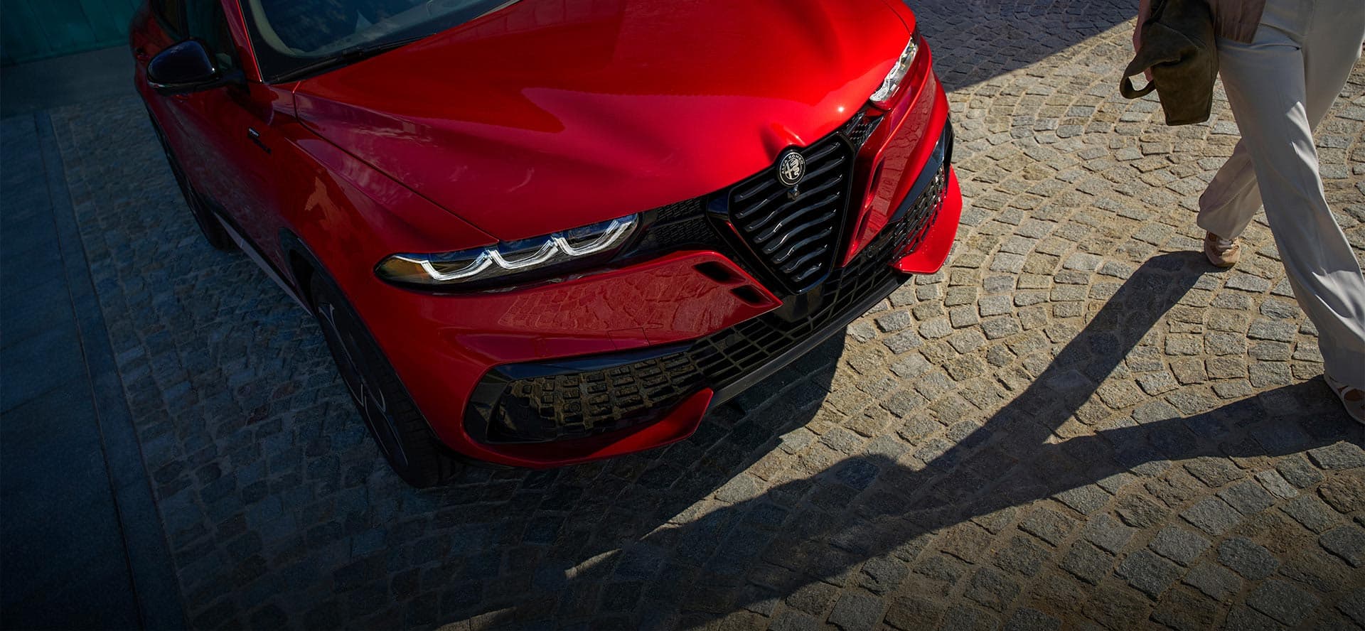 2026 Alfa Romeo Tonale exterior showcasing Italian design with new Dark Miron Concave V Scudetto grille and sculpted body lines