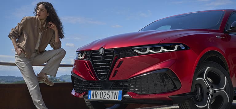 The front end of a red 2026 Alfa Romeo Tonale Sport Speciale.