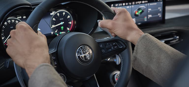 The steering wheel on a 2026 Alfa Romeo Tonale Sport Speciale.