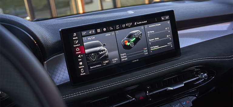 The Uconnect touchscreen in a 2026 Alfa Romeo Tonale displaying detailed vehicle information.