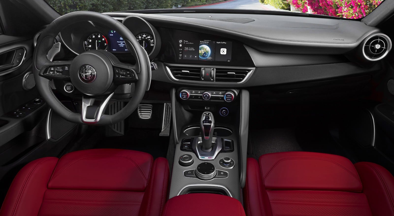 A 360-degree view of the 2023 Alfa Romeo Giulia interior, beginning with the steering wheet, center stack controls and dash.