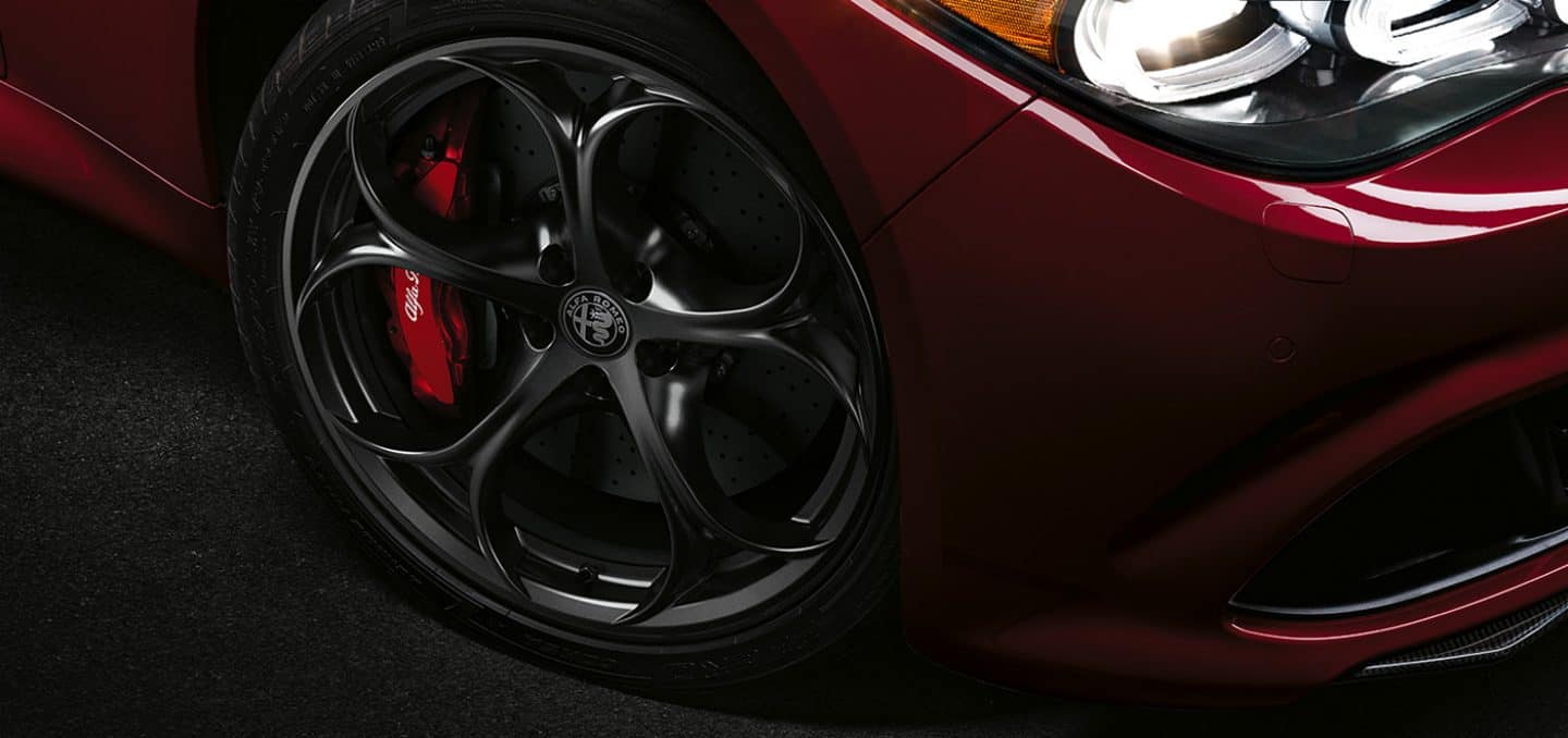 Display A close-up of the passenger-side front wheel and tire on the 2024 Alfa Romeo Giulia Quadrifoglio.